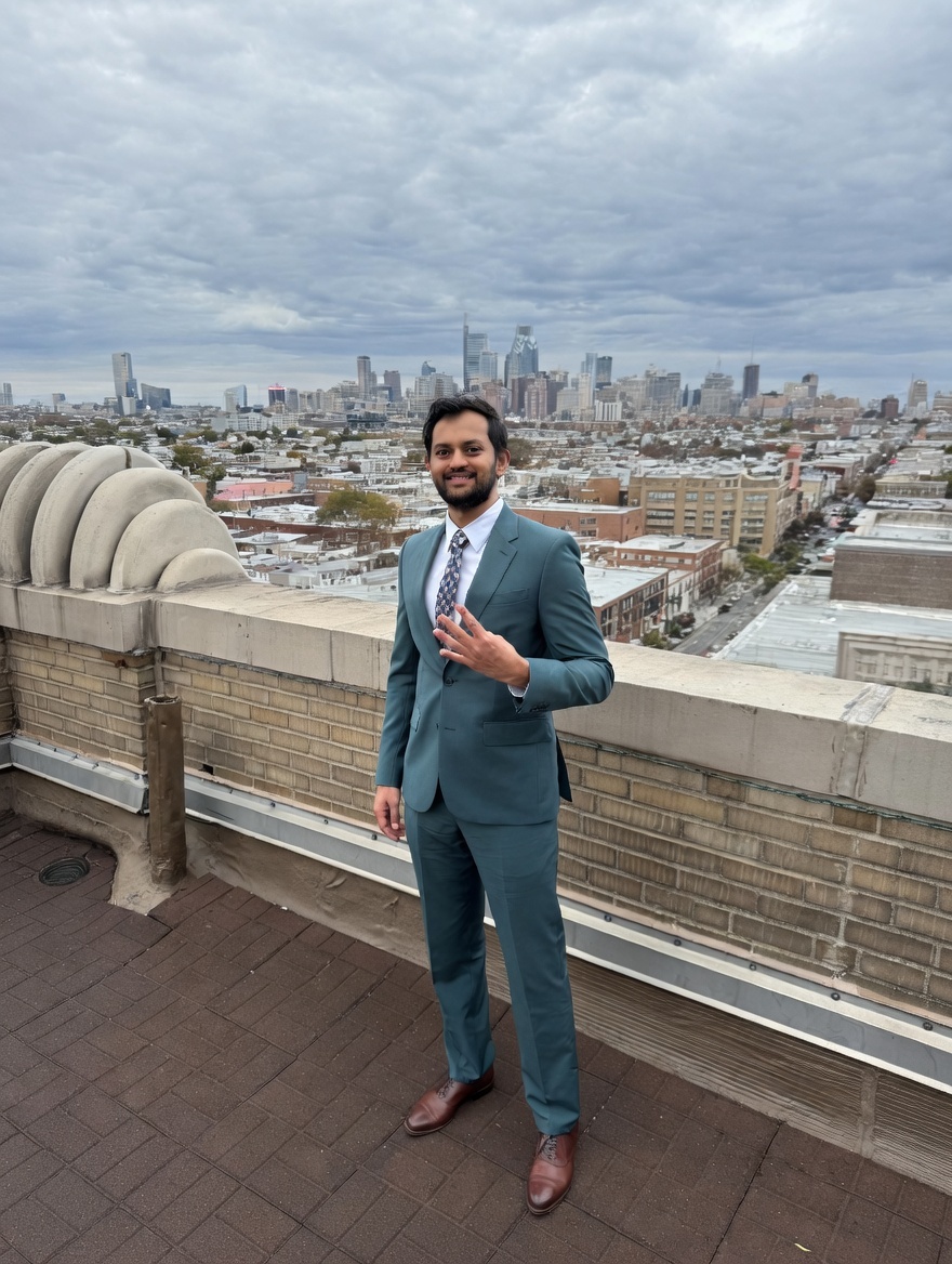 Milan Patel on Philadelphia rooftop in teal suit